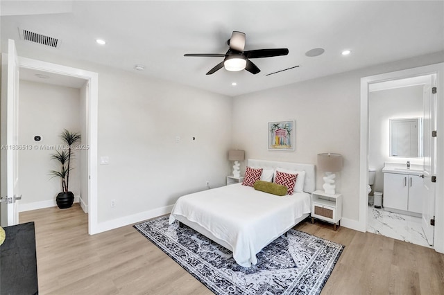 1617 NE 11th St Unit 1, Fort Lauderdale, FL 33304 - bedroom with recessed lighting, ceiling fan, light wood-style flooring, and ensuite bathroom