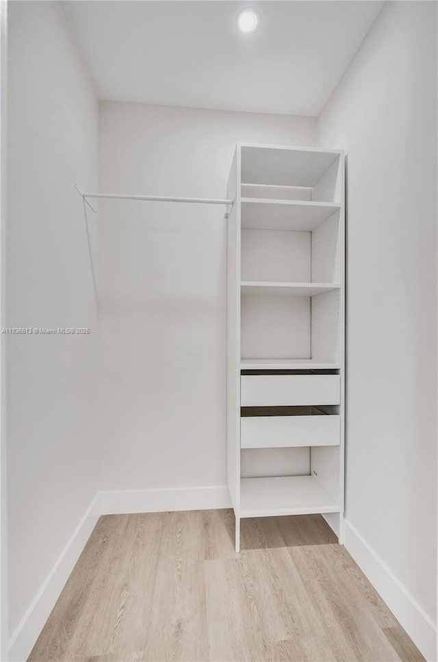 1617 NE 11th St Unit 1, Fort Lauderdale, FL 33304 - walk in closet featuring wood finished floors