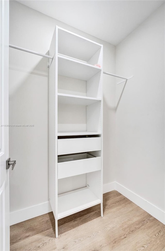 1617 NE 11th St Unit 1, Fort Lauderdale, FL 33304 - walk in closet featuring wood finished floors