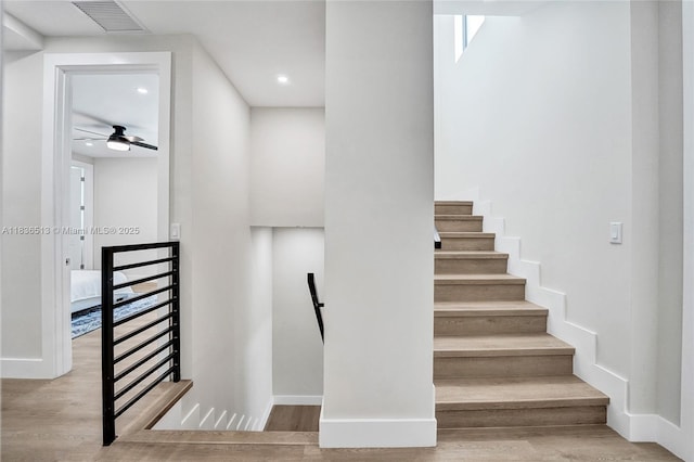 1617 NE 11th St Unit 1, Fort Lauderdale, FL 33304 - staircase featuring wood finished floors, ceiling fan, and recessed lighting