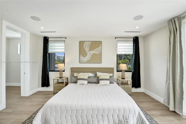 1617 NE 11th St Unit 1, Fort Lauderdale, FL 33304 - bedroom featuring wood finished floors and recessed lighting