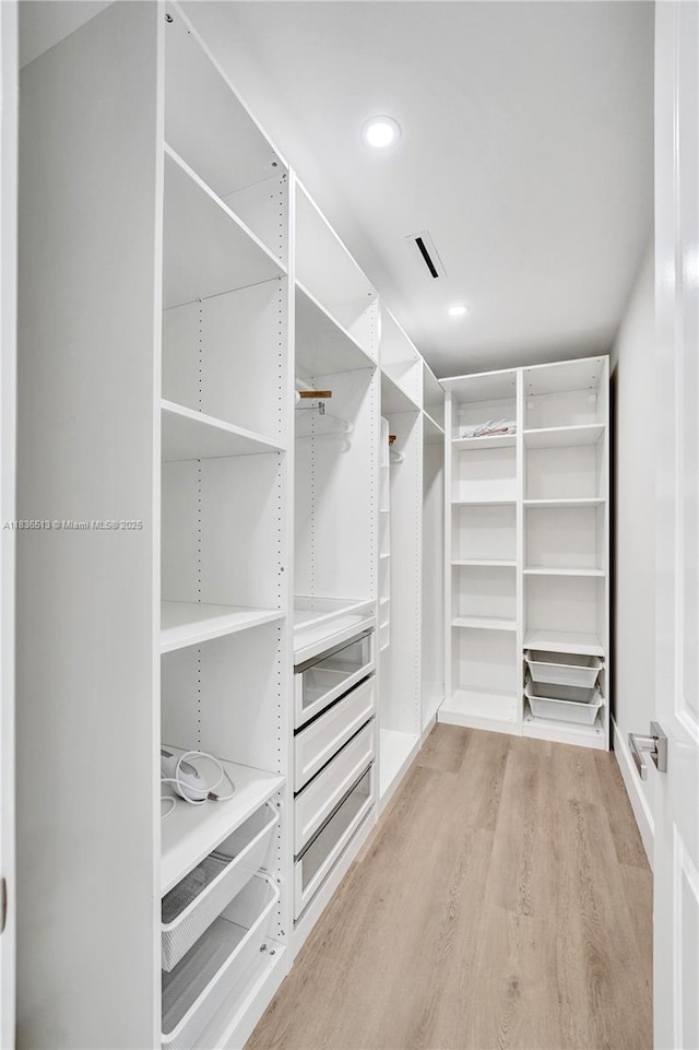 1617 NE 11th St Unit 1, Fort Lauderdale, FL 33304 - walk in closet with light wood finished floors
