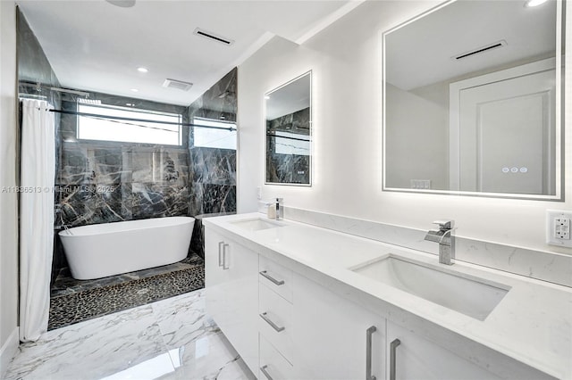 1617 NE 11th St Unit 1, Fort Lauderdale, FL 33304 - full bath featuring double vanity, marble tiled floors, a freestanding tub, recessed lighting, and a shower with shower curtain
