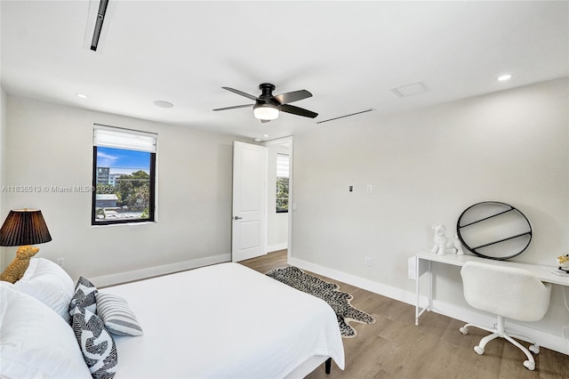 1617 NE 11th St Unit 1, Fort Lauderdale, FL 33304 - bedroom featuring multiple windows, wood finished floors, recessed lighting, and a ceiling fan