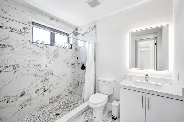 1617 NE 11th St Unit 1, Fort Lauderdale, FL 33304 - bathroom featuring a marble finish shower, vanity, and marble finish floors