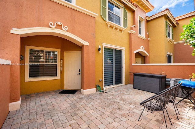 724 SW 106th Ave Unit 2010, Pembroke Pines, FL 33025 - doorway to property featuring stucco siding and a patio area