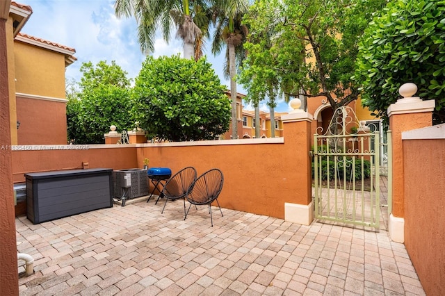 724 SW 106th Ave Unit 2010, Pembroke Pines, FL 33025 - view of patio featuring a gate