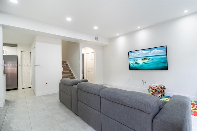 724 SW 106th Ave Unit 2010, Pembroke Pines, FL 33025 - living room featuring stairs, recessed lighting, arched walkways, and light tile patterned flooring