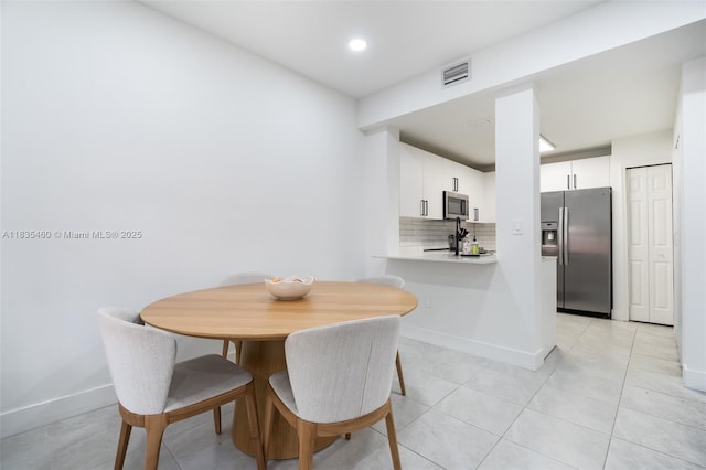 724 SW 106th Ave Unit 2010, Pembroke Pines, FL 33025 - dining space with baseboards and light tile patterned flooring