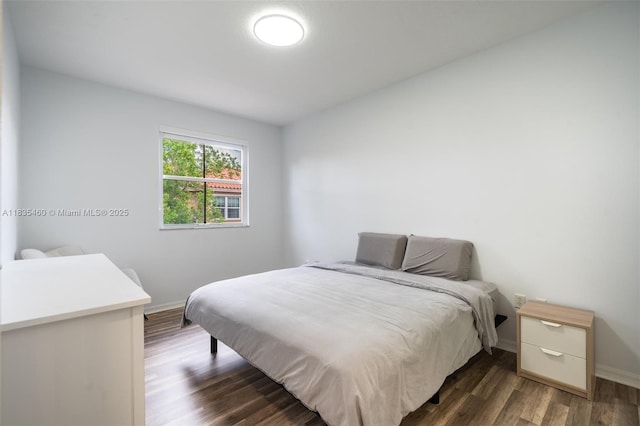 724 SW 106th Ave Unit 2010, Pembroke Pines, FL 33025 - bedroom with baseboards and dark wood-style floors