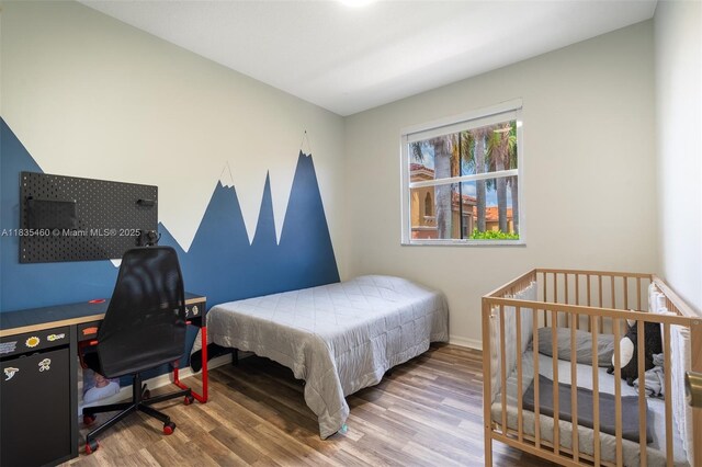 724 SW 106th Ave Unit 2010, Pembroke Pines, FL 33025 - bedroom featuring wood finished floors and a desk