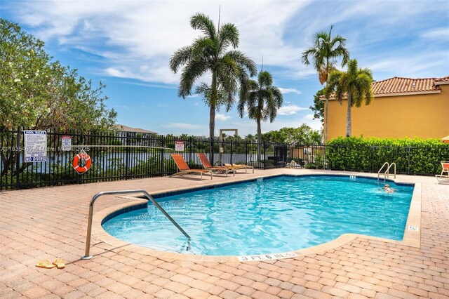 724 SW 106th Ave Unit 2010, Pembroke Pines, FL 33025 - community pool with a patio area