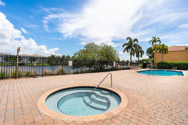 724 SW 106th Ave Unit 2010, Pembroke Pines, FL 33025 - community pool with a hot tub, a patio, and a water view