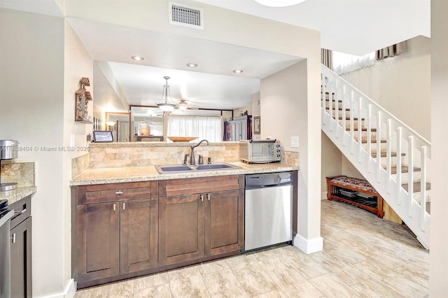 9715 NW 23rd Ct, Pembroke Pines, FL 33024 - kitchen featuring stainless steel dishwasher, backsplash, ceiling fan, light stone countertops, and recessed lighting