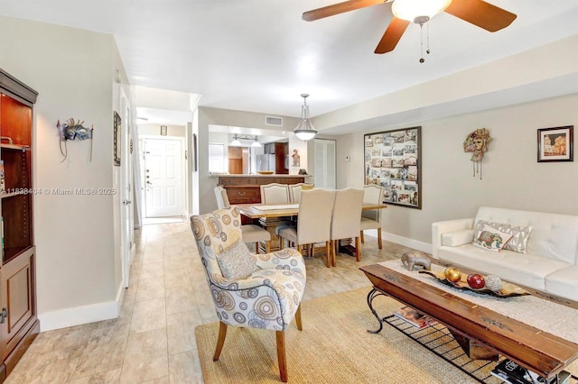 9715 NW 23rd Ct, Pembroke Pines, FL 33024 - living area featuring a ceiling fan and baseboards