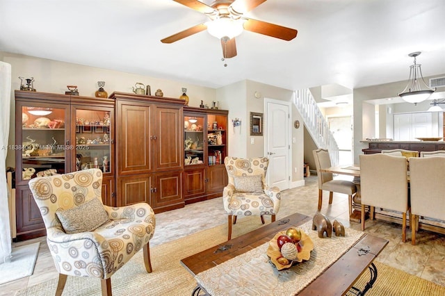 9715 NW 23rd Ct, Pembroke Pines, FL 33024 - living area featuring ceiling fan and stairway