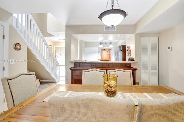 9715 NW 23rd Ct, Pembroke Pines, FL 33024 - dining area with stairway and wood finished floors