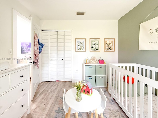 13790 SW 147th Cir Ln Unit 2-9, Miami, FL 33186 - bedroom featuring light wood-type flooring, a nursery area, and a closet