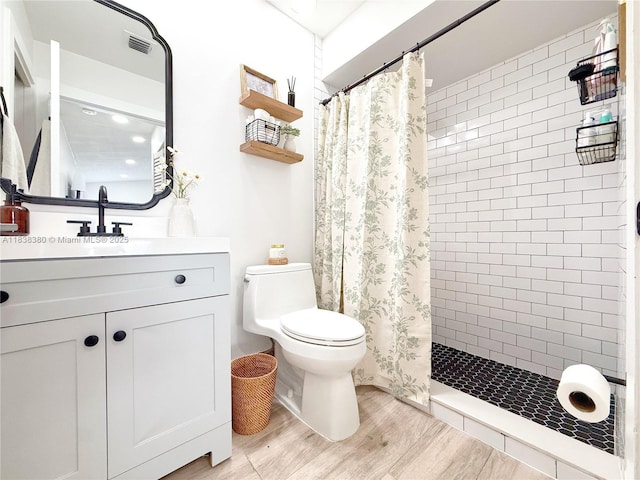 13790 SW 147th Cir Ln Unit 2-9, Miami, FL 33186 - bathroom with wood finished floors, a tile shower, and vanity