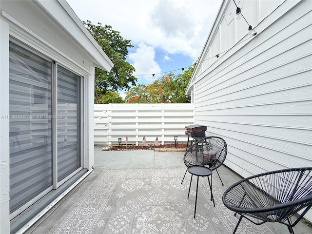 13790 SW 147th Cir Ln Unit 2-9, Miami, FL 33186 - view of patio / terrace featuring a garage