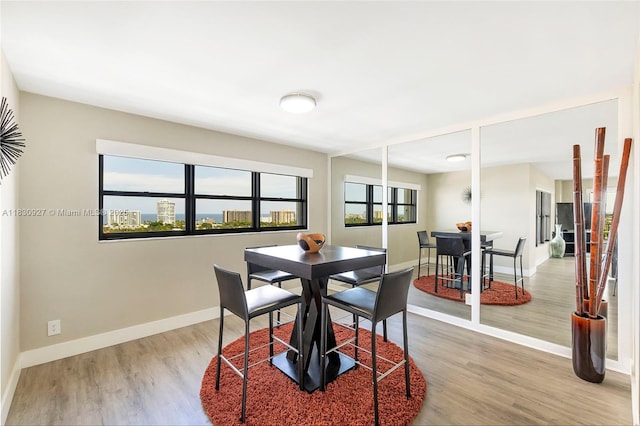 3200 N Port Royale Dr N Unit 1612, Fort Lauderdale, FL 33308 - dining space with light wood-style flooring and baseboards