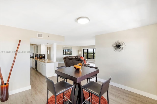 3200 N Port Royale Dr N Unit 1612, Fort Lauderdale, FL 33308 - dining room featuring light wood-style floors and baseboards