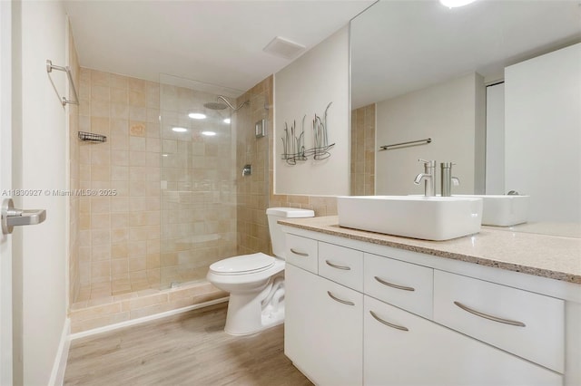 3200 N Port Royale Dr N Unit 1612, Fort Lauderdale, FL 33308 - bathroom featuring vanity, tiled shower, and wood finished floors
