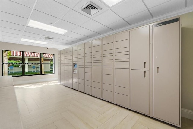 3200 N Port Royale Dr N Unit 1612, Fort Lauderdale, FL 33308 - view of home's community with a package area, a paneled ceiling, and tile walls