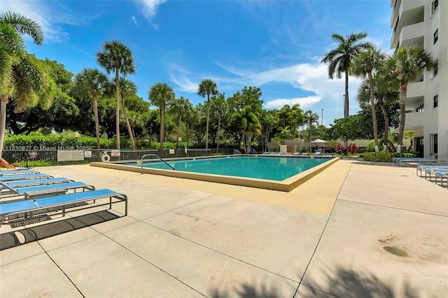 3200 N Port Royale Dr N Unit 1612, Fort Lauderdale, FL 33308 - community pool featuring a patio and view of wooded area