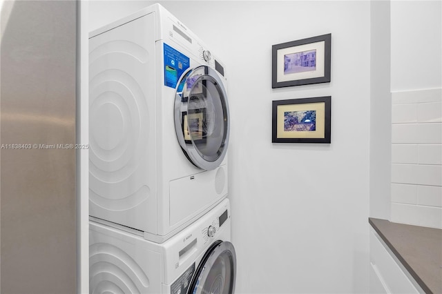 3 Island Ave Unit 12E, Miami Beach, FL 33139 - laundry area featuring stacked washing machine and dryer