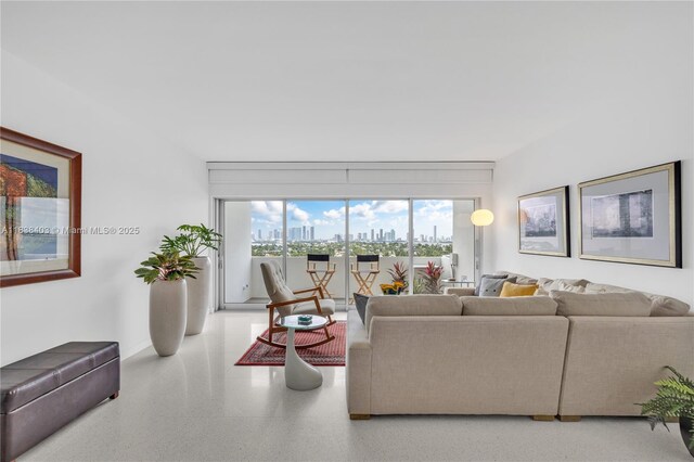 3 Island Ave Unit 12E, Miami Beach, FL 33139 - living area with speckled floor and baseboards