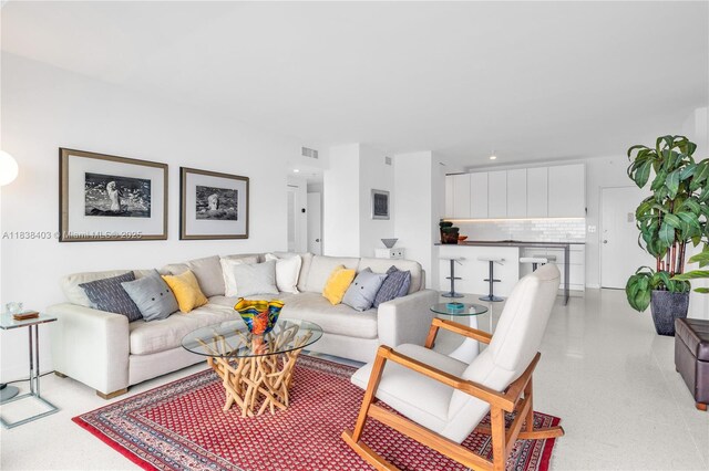 3 Island Ave Unit 12E, Miami Beach, FL 33139 - living room featuring dark aggregate flooring