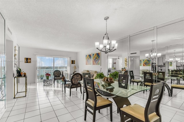 4001 Hillcrest Dr Unit 812, Hollywood, FL 33021 - dining room featuring a chandelier, a textured ceiling, and light tile patterned flooring