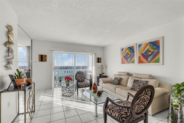 4001 Hillcrest Dr Unit 812, Hollywood, FL 33021 - living area featuring plenty of natural light, light tile patterned floors, and a textured ceiling