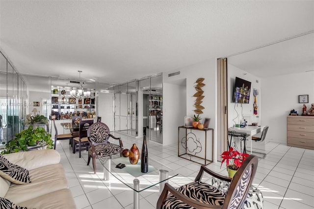 4001 Hillcrest Dr Unit 812, Hollywood, FL 33021 - living area featuring a chandelier, light tile patterned floors, and a textured ceiling