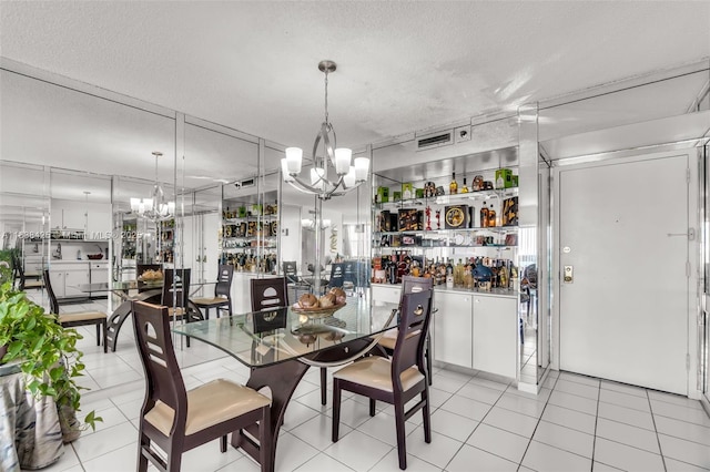 4001 Hillcrest Dr Unit 812, Hollywood, FL 33021 - dining space featuring a chandelier, a textured ceiling, and light tile patterned flooring