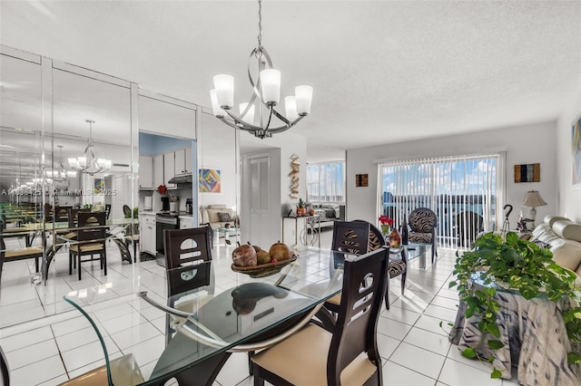 4001 Hillcrest Dr Unit 812, Hollywood, FL 33021 - dining room with a chandelier, light tile patterned floors, and a textured ceiling