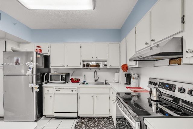 4001 Hillcrest Dr Unit 812, Hollywood, FL 33021 - kitchen featuring appliances with stainless steel finishes, under cabinet range hood, light countertops, white cabinetry, and a textured ceiling