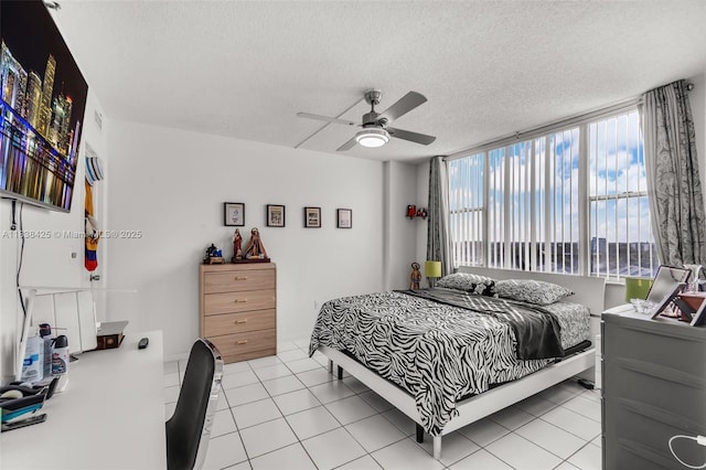 4001 Hillcrest Dr Unit 812, Hollywood, FL 33021 - bedroom featuring a textured ceiling, light tile patterned flooring, and a ceiling fan