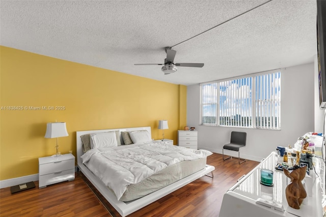 4001 Hillcrest Dr Unit 812, Hollywood, FL 33021 - bedroom featuring wood finished floors, a textured ceiling, and a ceiling fan