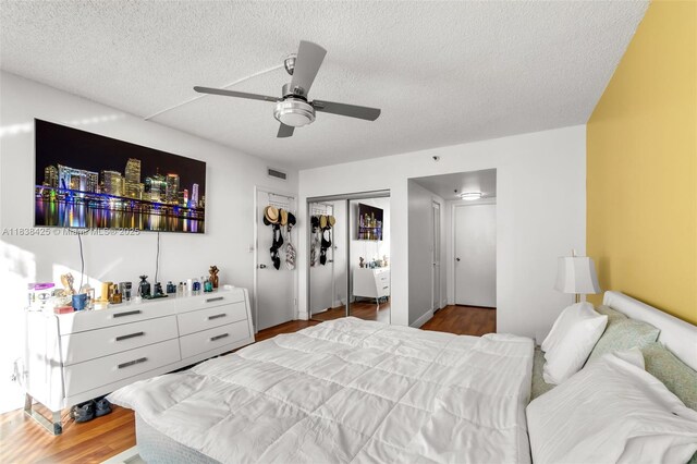 4001 Hillcrest Dr Unit 812, Hollywood, FL 33021 - bedroom featuring a textured ceiling, wood finished floors, ceiling fan, and a closet