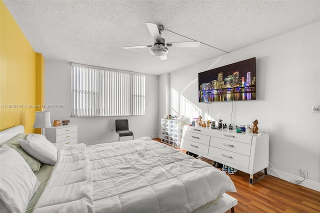 4001 Hillcrest Dr Unit 812, Hollywood, FL 33021 - bedroom with a textured ceiling, wood finished floors, and a ceiling fan