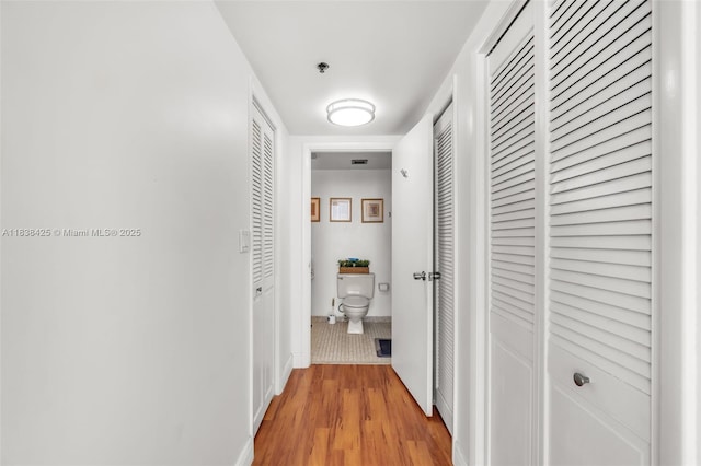 4001 Hillcrest Dr Unit 812, Hollywood, FL 33021 - corridor featuring light wood-style flooring and baseboards