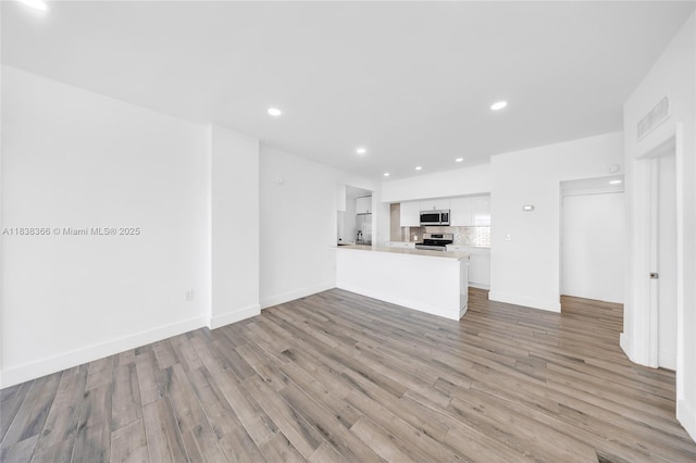 13155 Ixora Ct Unit 1105, North Miami, FL 33181 - unfurnished living room with recessed lighting and light wood-style flooring