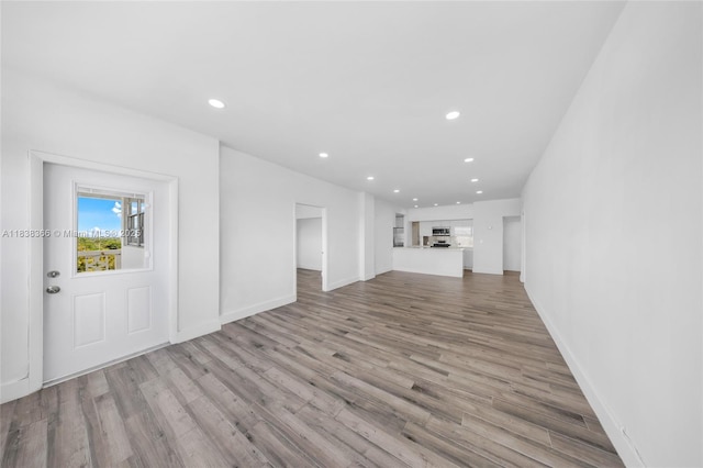 13155 Ixora Ct Unit 1105, North Miami, FL 33181 - unfurnished living room with recessed lighting and light wood-style floors