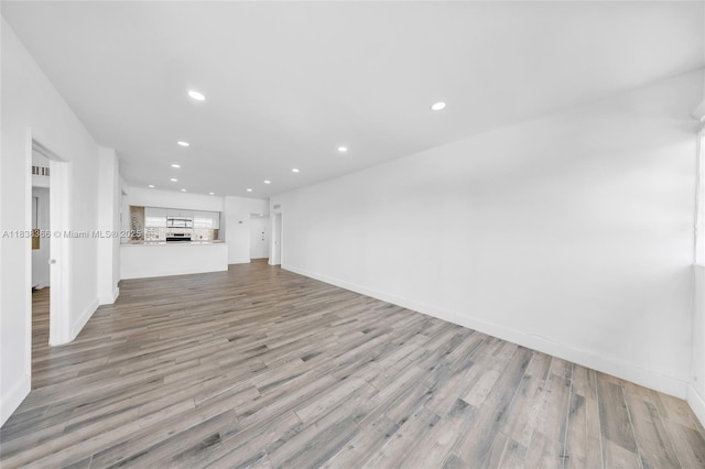 13155 Ixora Ct Unit 1105, North Miami, FL 33181 - unfurnished living room featuring recessed lighting and light wood-style flooring