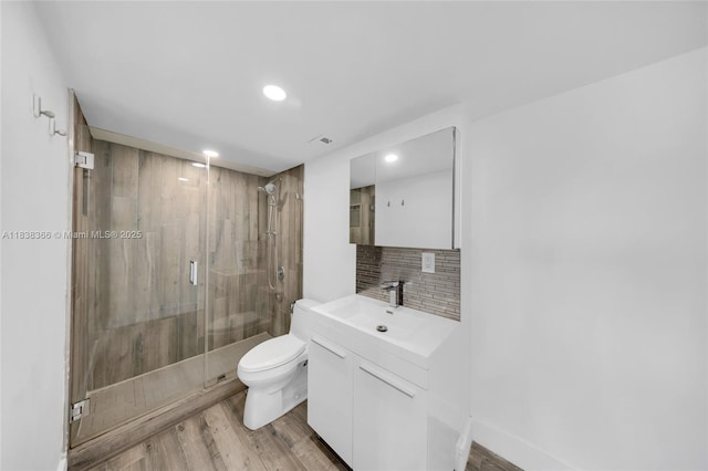 13155 Ixora Ct Unit 1105, North Miami, FL 33181 - bathroom featuring wood finished floors, vanity, backsplash, a shower stall, and recessed lighting