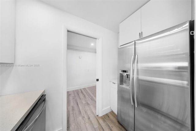 13155 Ixora Ct Unit 1105, North Miami, FL 33181 - kitchen featuring stainless steel appliances, white cabinets, and light wood-style floors