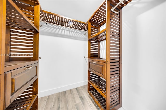 13155 Ixora Ct Unit 1105, North Miami, FL 33181 - walk in closet featuring wood finished floors