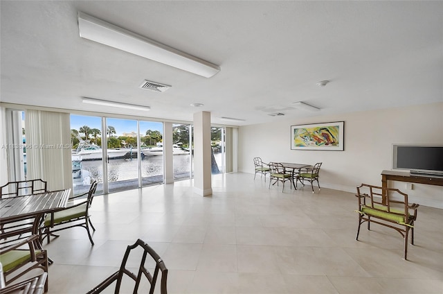 13155 Ixora Ct Unit 1105, North Miami, FL 33181 - dining space featuring floor to ceiling windows and light tile patterned floors
